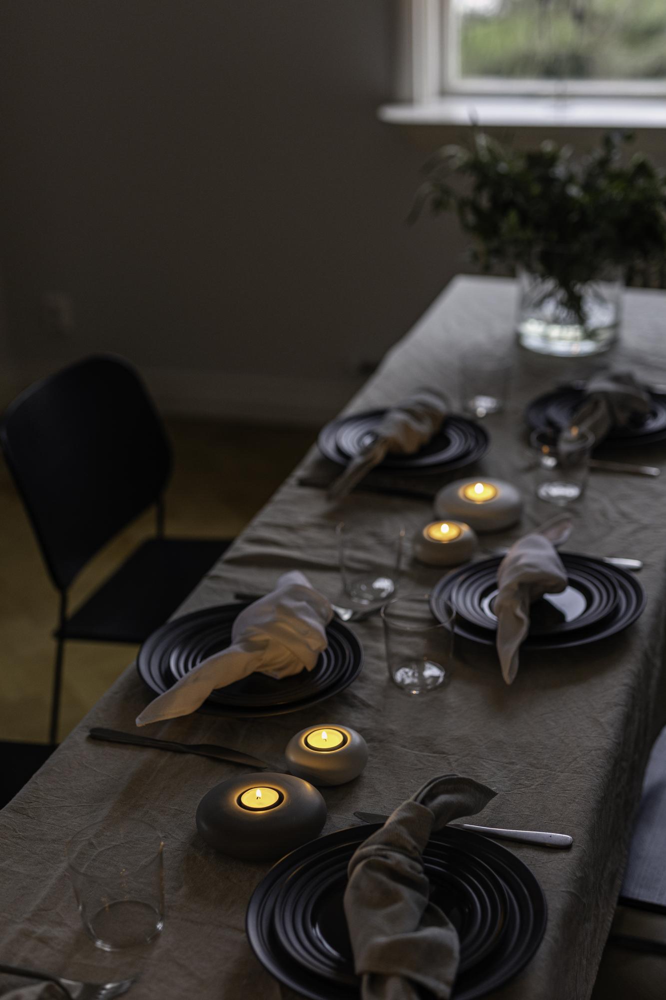 long table set for private dinner with candles
